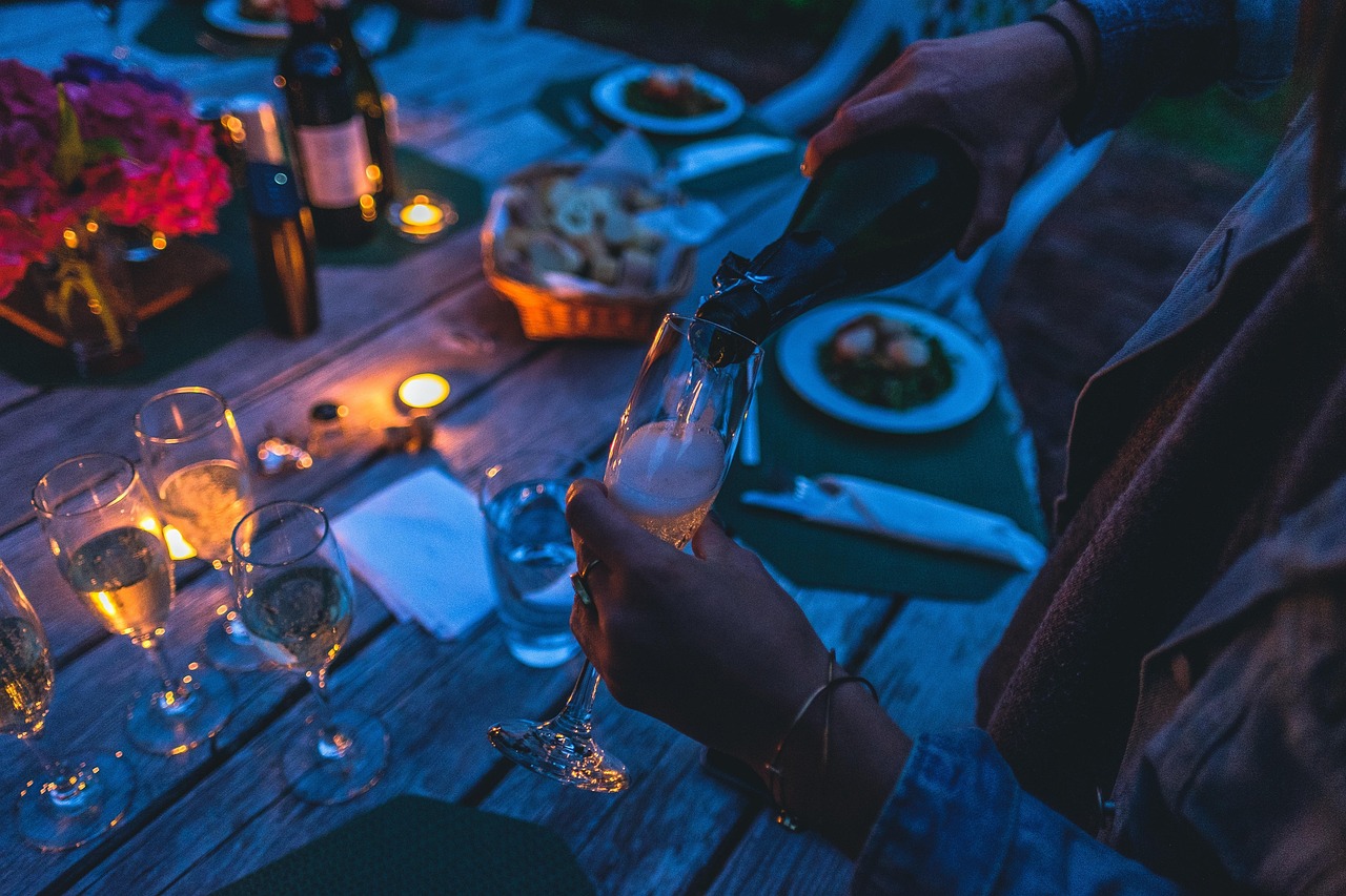 celebration, champagne, glasses, pour, pouring, champagne glasses, bottle, champagne bottle, glassware, stemware, dark, dinner, evening, light, party, person, table, drinks, cheers, champagne, dinner, dinner, party, party, party, party, party